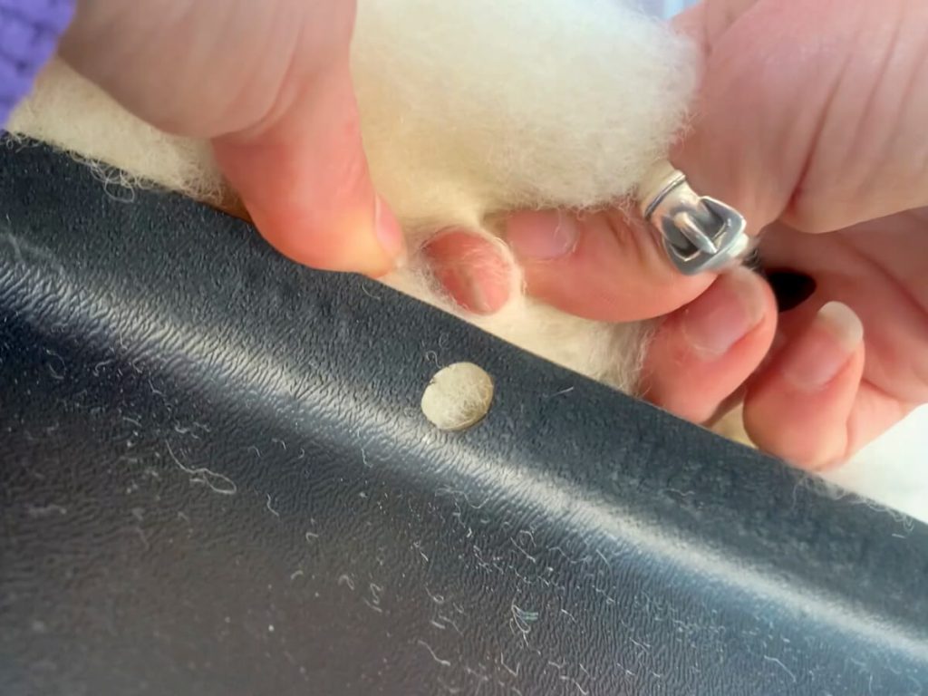 We laid a half batt over the wheel well and then made small holes for the OEM connectors.