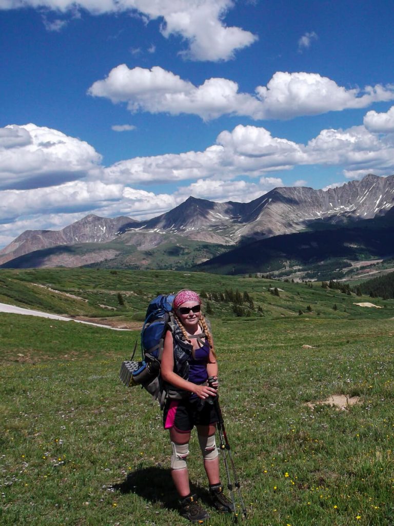 Woman thru-hiker on the Colorado Trail wearing the Gregory Deva backpack.