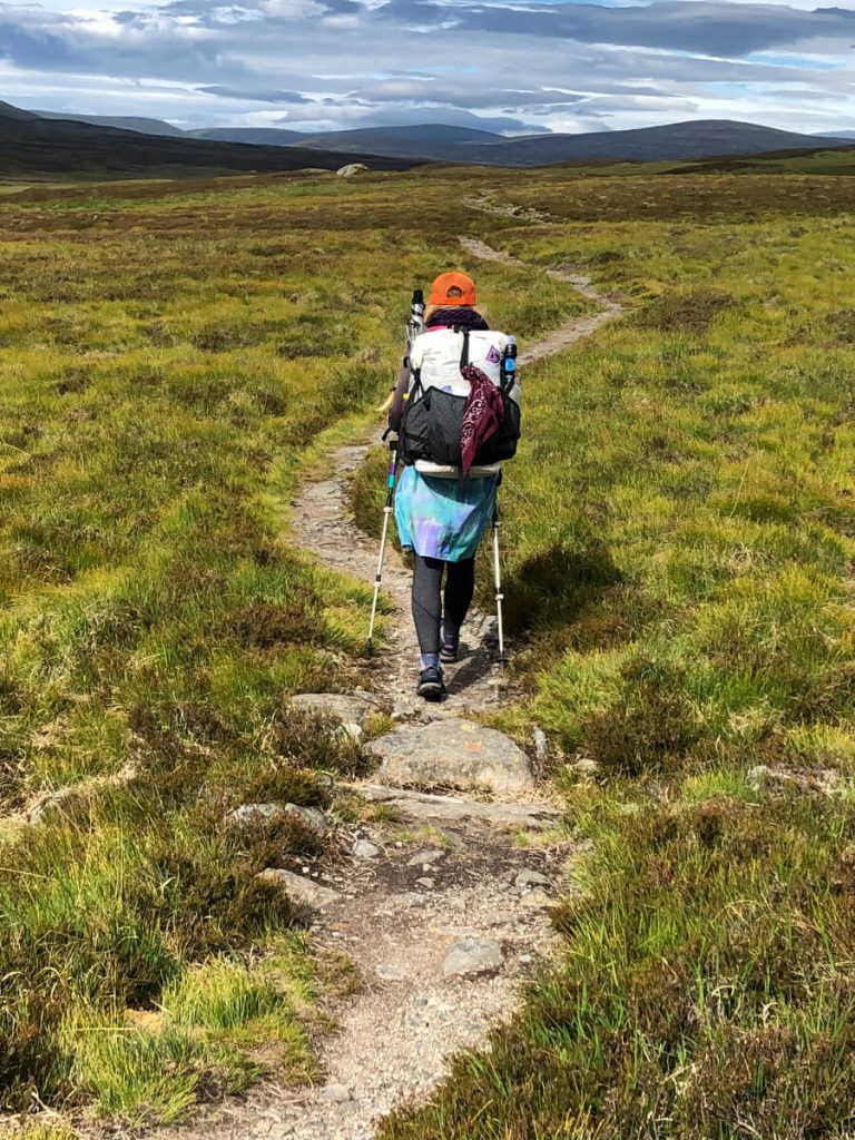 Woman thru-hiker on the Scottish National Trail wearing a Hyperlite Mountain Gear Southwest backpack.