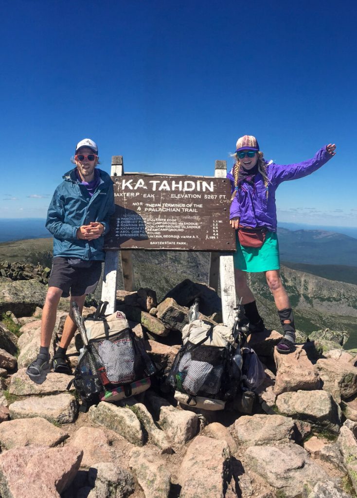 Thru-hiking couple on Mt Katahdin starting an Appalachian Trail Southbound thru-hike.