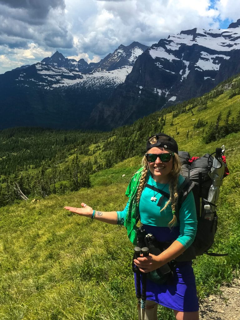 Woman thru-hiker on the Pacific Northwest Trail wearing a Mountain Laurel Designs backpack.