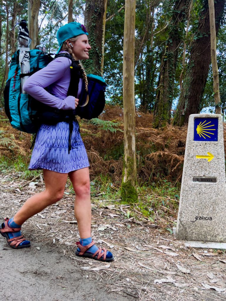 Woman thru-hiker on the Camino de Santiago wearing the Six Moon Designs All Day Carry Backpack.