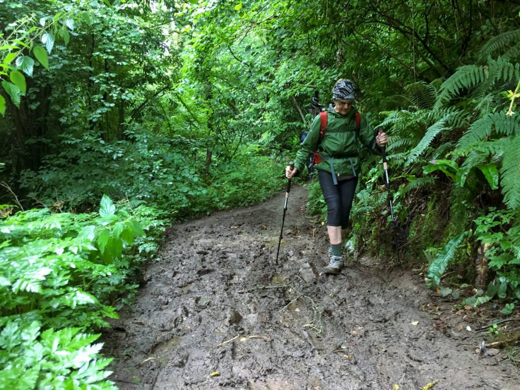 My Mom dodging mud on the Camino Primitivo.