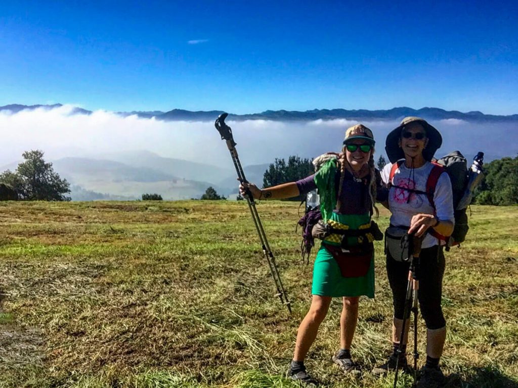 My Mom and I hiking the Camino Primitivo in the mountains with a cloud inversion.